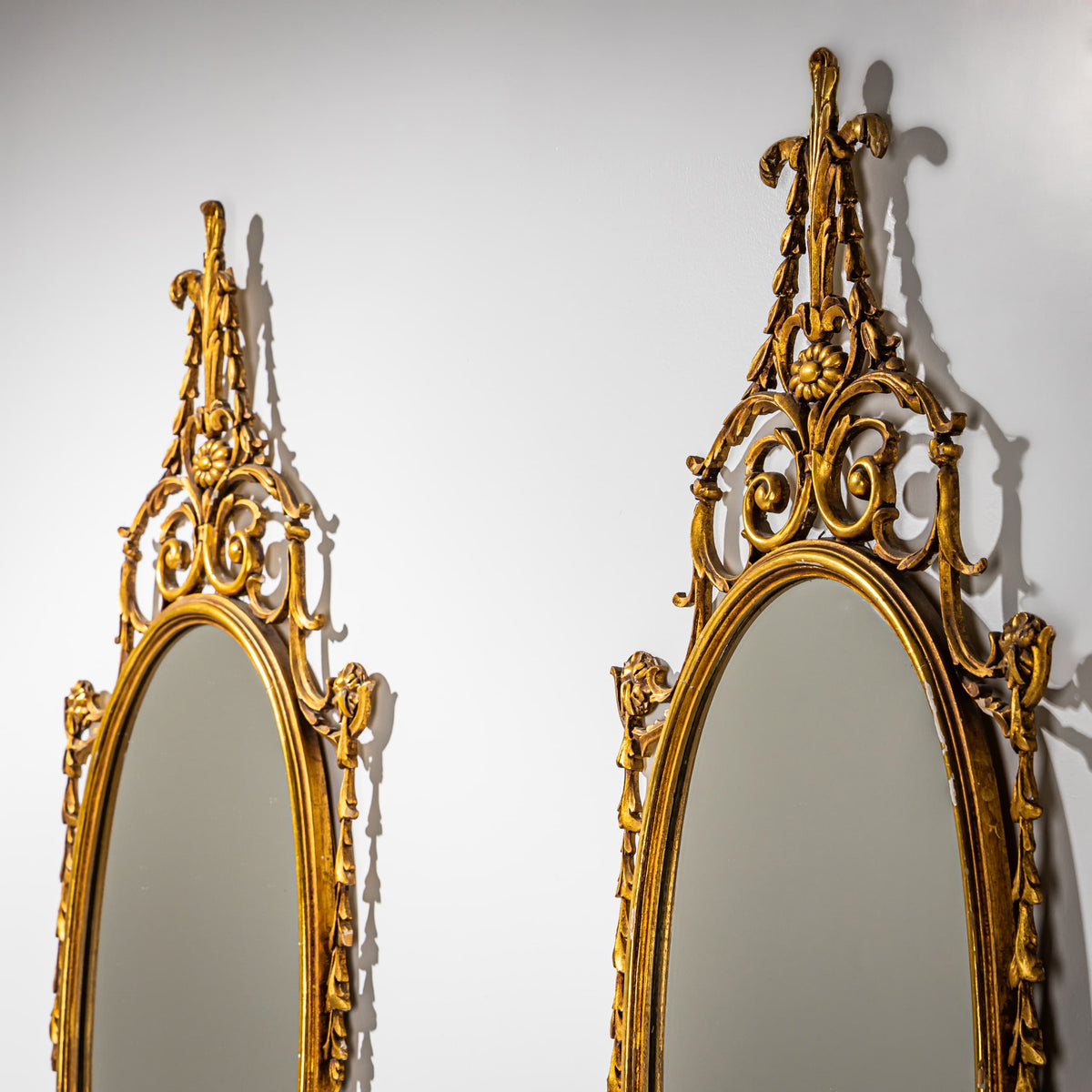 Pair of oval Giltwood Wall Mirrors, Italy Mid-20th Century