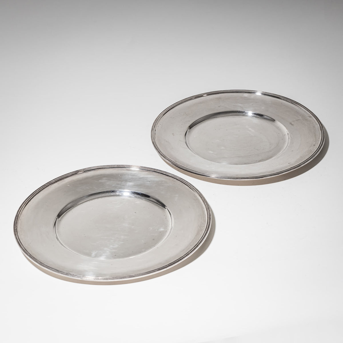 Two Silver Charger Plates, Marked Wilkens