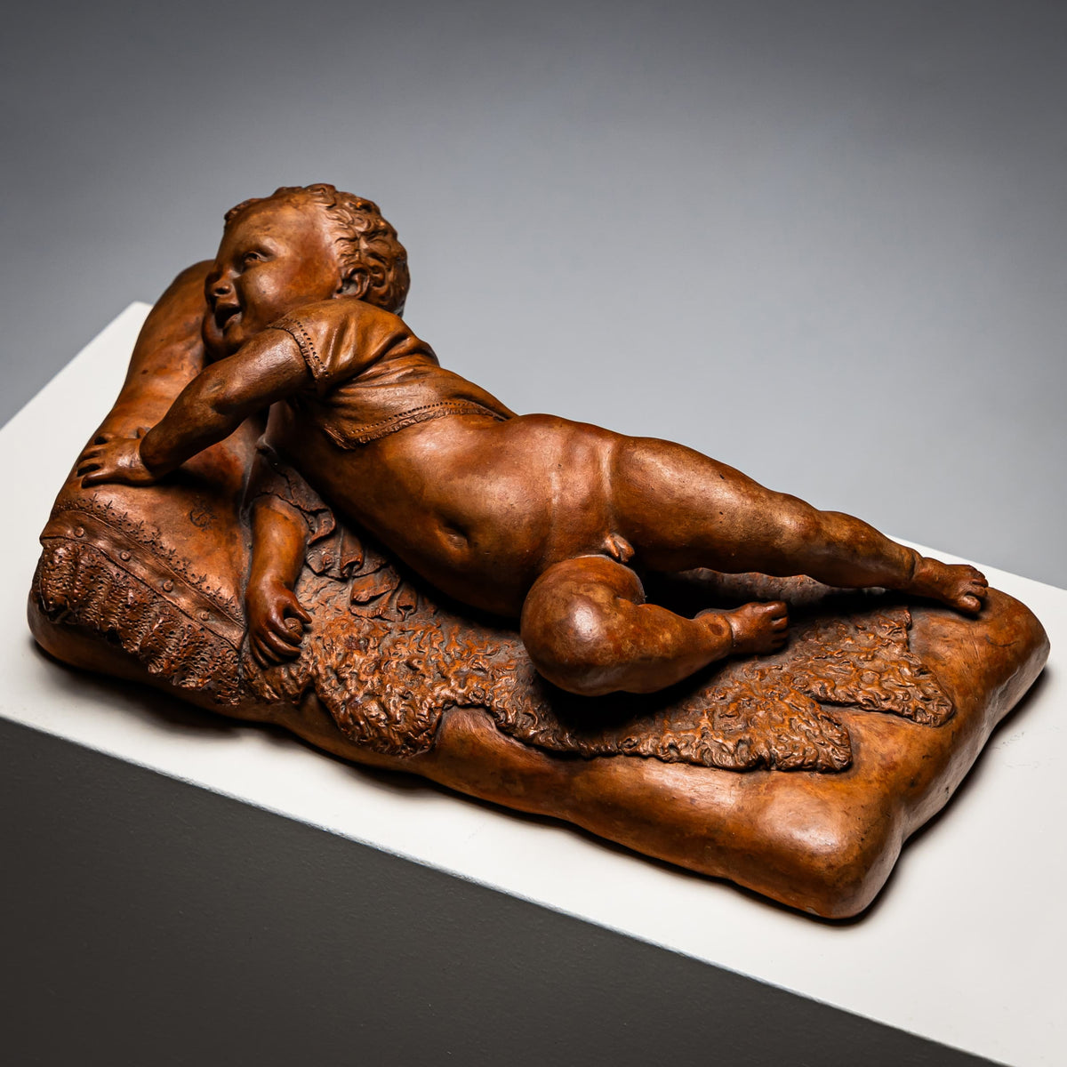 Reclining infant in terracotta, sign. F. Sans, probably Spain, Late 19th century