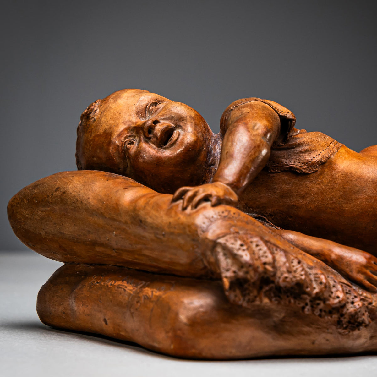 Reclining infant in terracotta, sign. F. Sans, probably Spain, Late 19th century