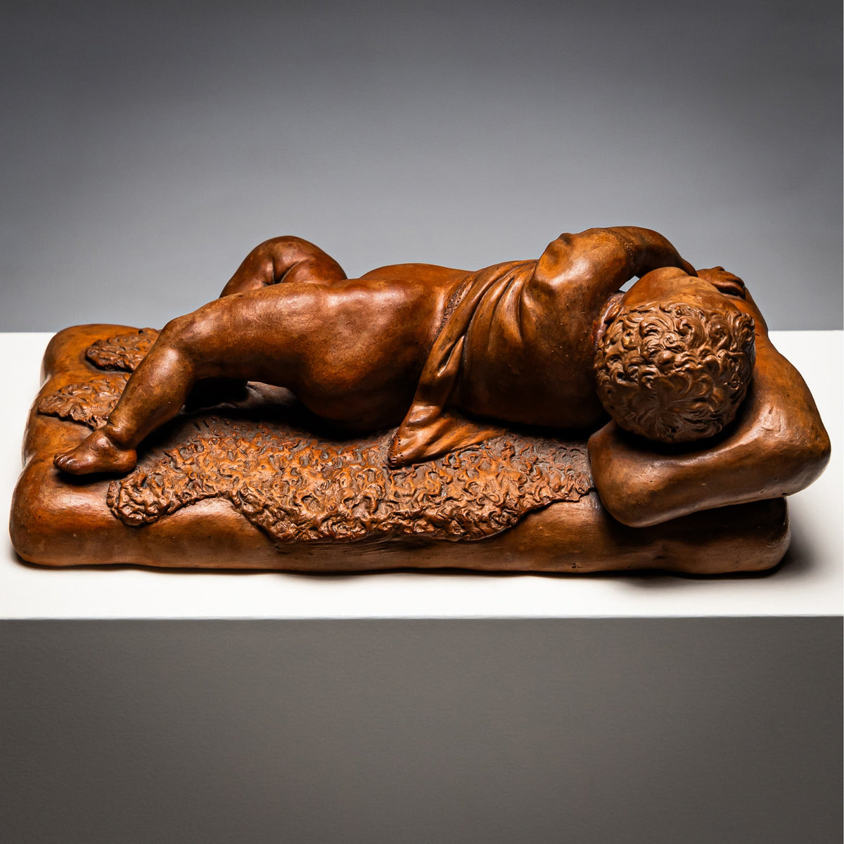 Reclining infant in terracotta, sign. F. Sans, probably Spain, Late 19th century