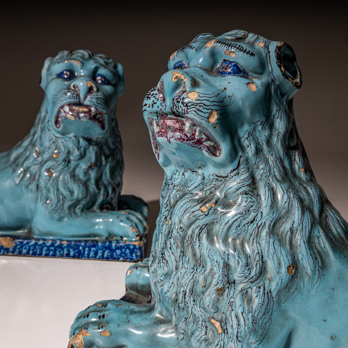 Pair of Recumbent Blue Faience Lions, probably France, 18th Century