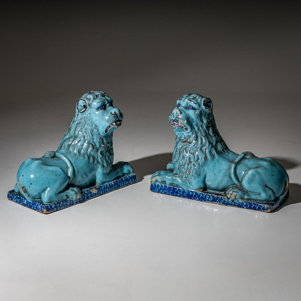 Pair of Recumbent Blue Faience Lions, probably France, 18th Century