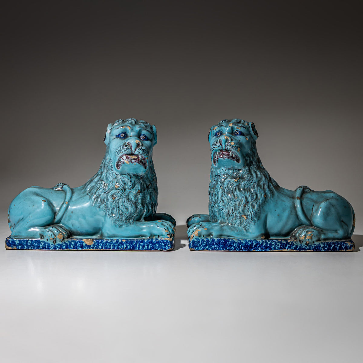 Pair of Recumbent Blue Faience Lions, probably France, 18th Century
