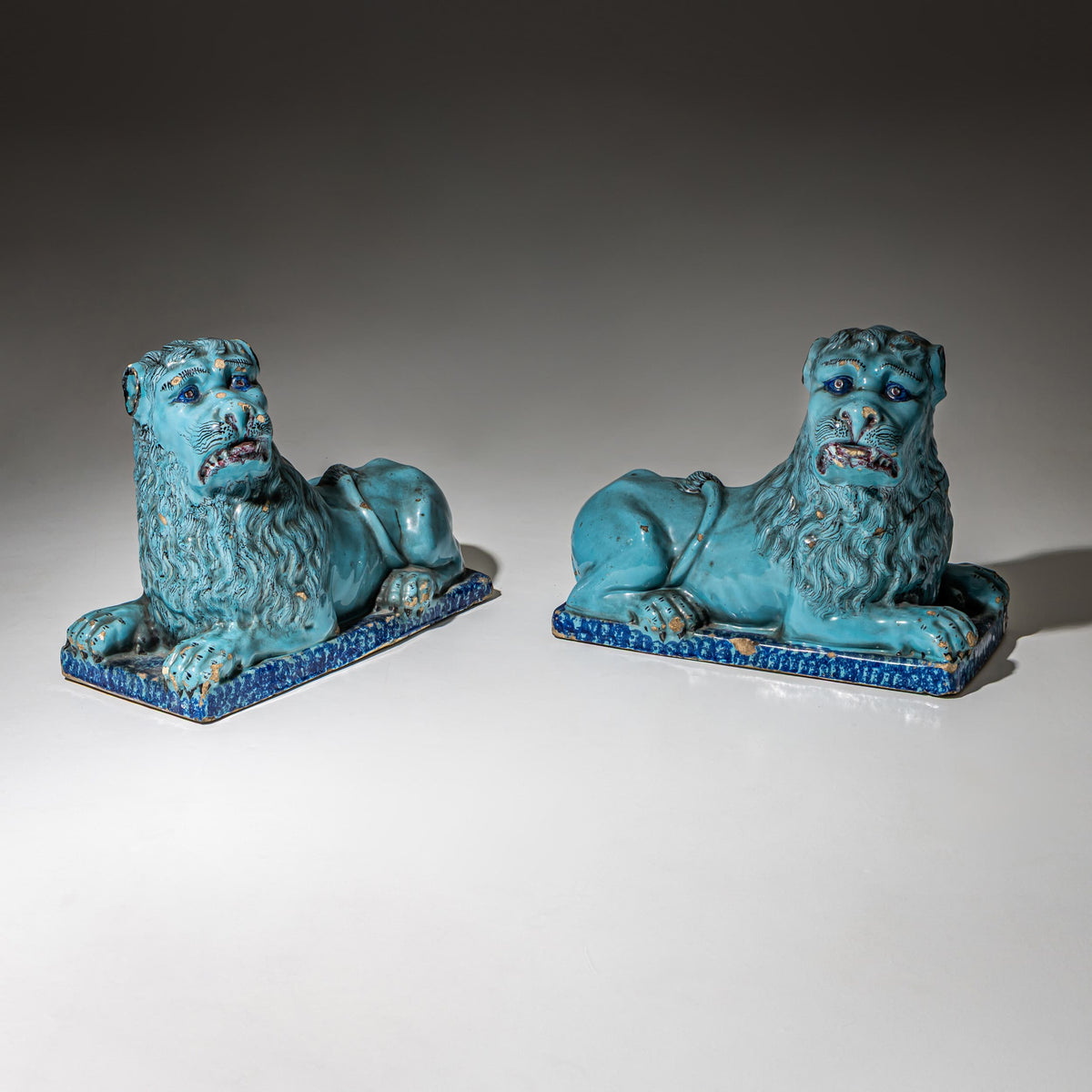 Pair of Recumbent Blue Faience Lions, probably France, 18th Century