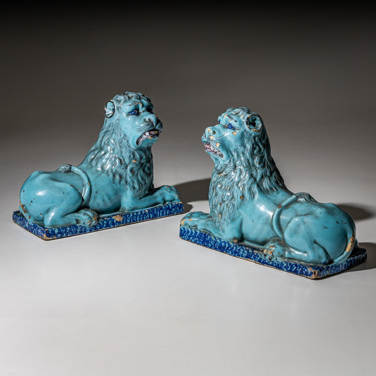 Pair of Recumbent Blue Faience Lions, probably France, 18th Century