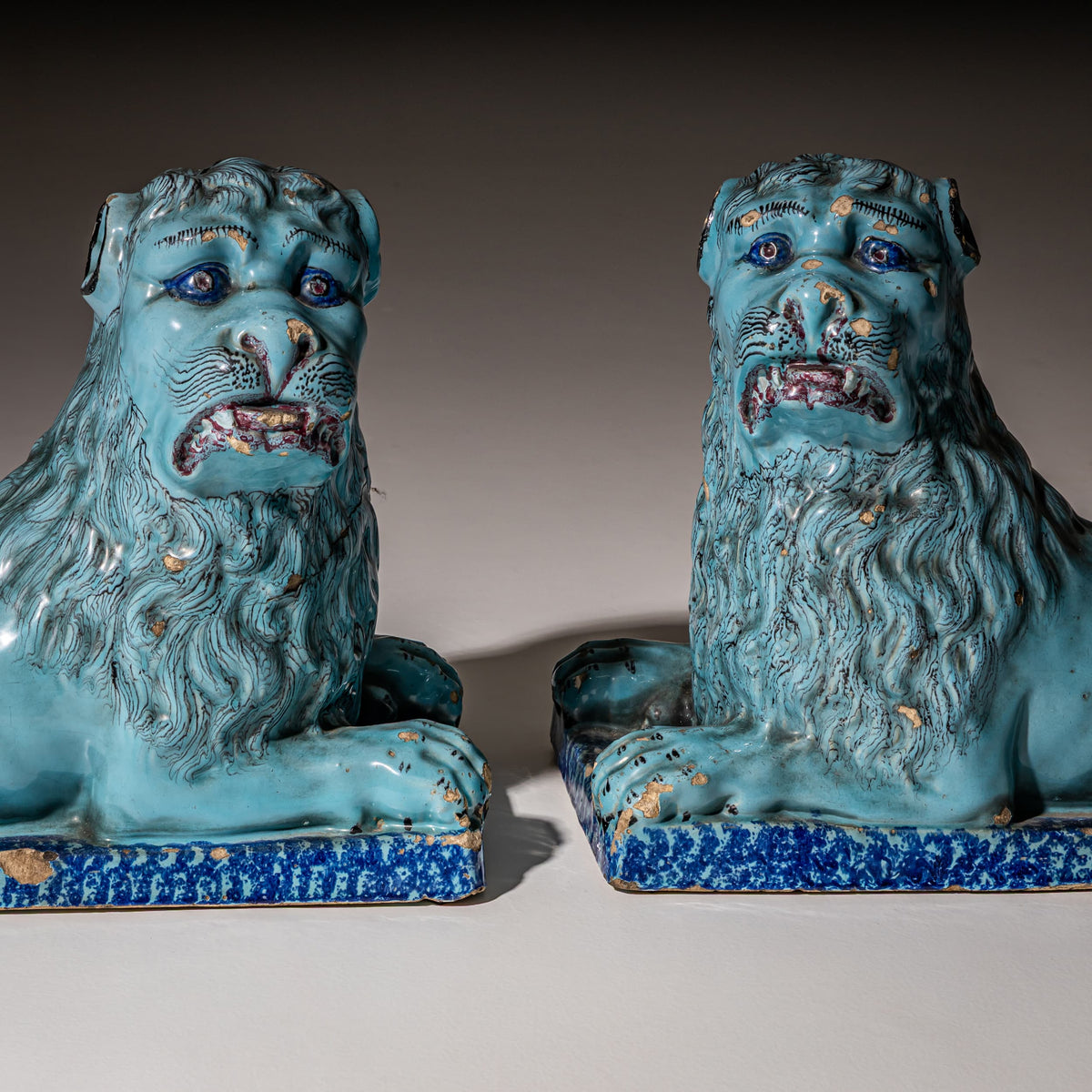 Pair of Recumbent Blue Faience Lions, probably France, 18th Century