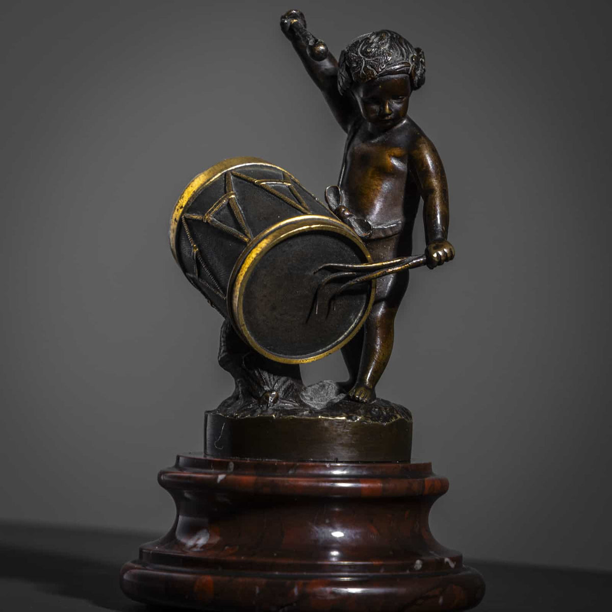 Small Bronze Sculpture of a drumming child, Late 19th Century