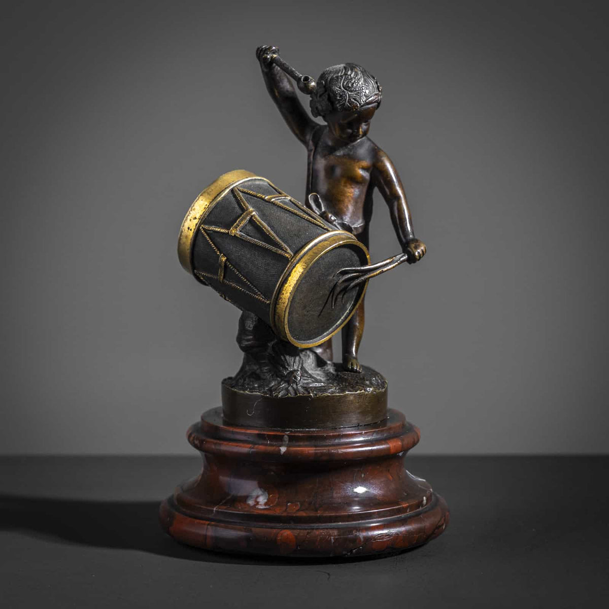 Small Bronze Sculpture of a drumming child, Late 19th Century