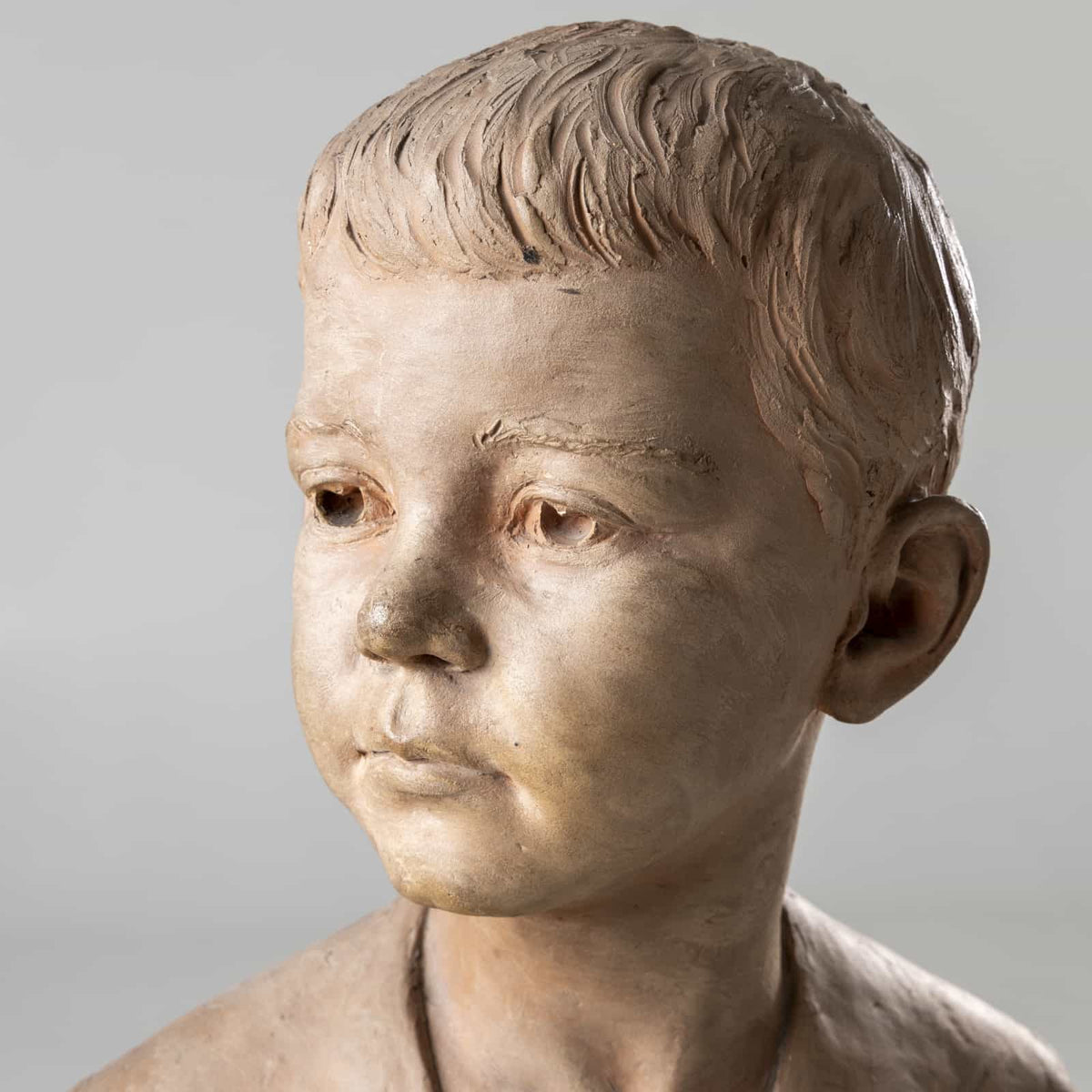 Bust of a boy in terracotta, signed H.M. Becoré, France, 2nd half of the 19th century