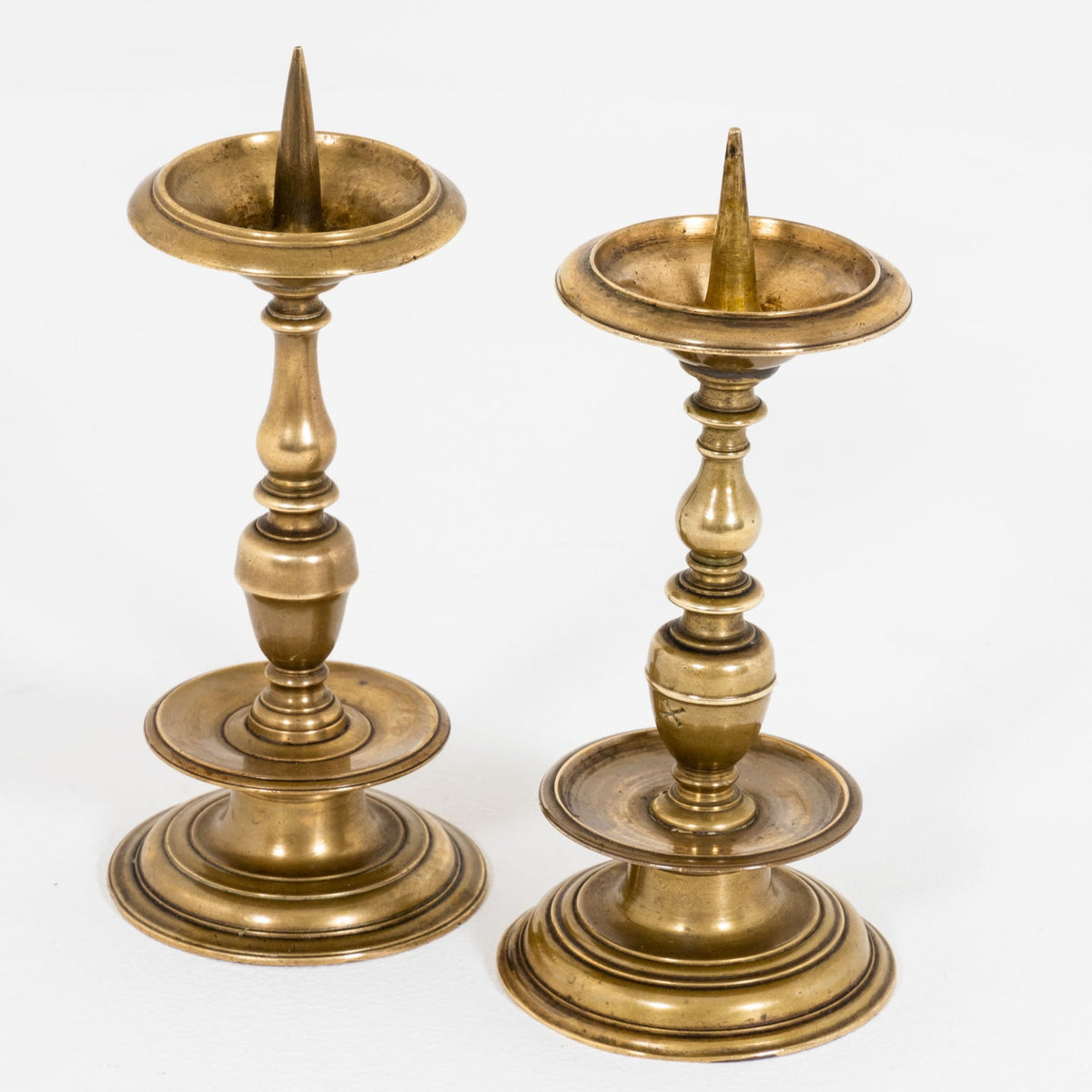 Two brass Candlesticks, probably German, 17th Century