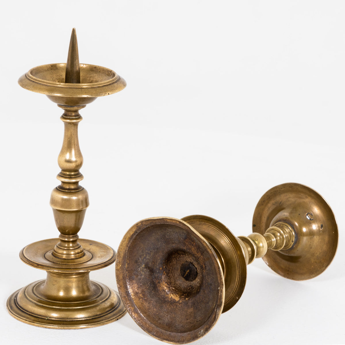 Two brass Candlesticks, probably German, 17th Century
