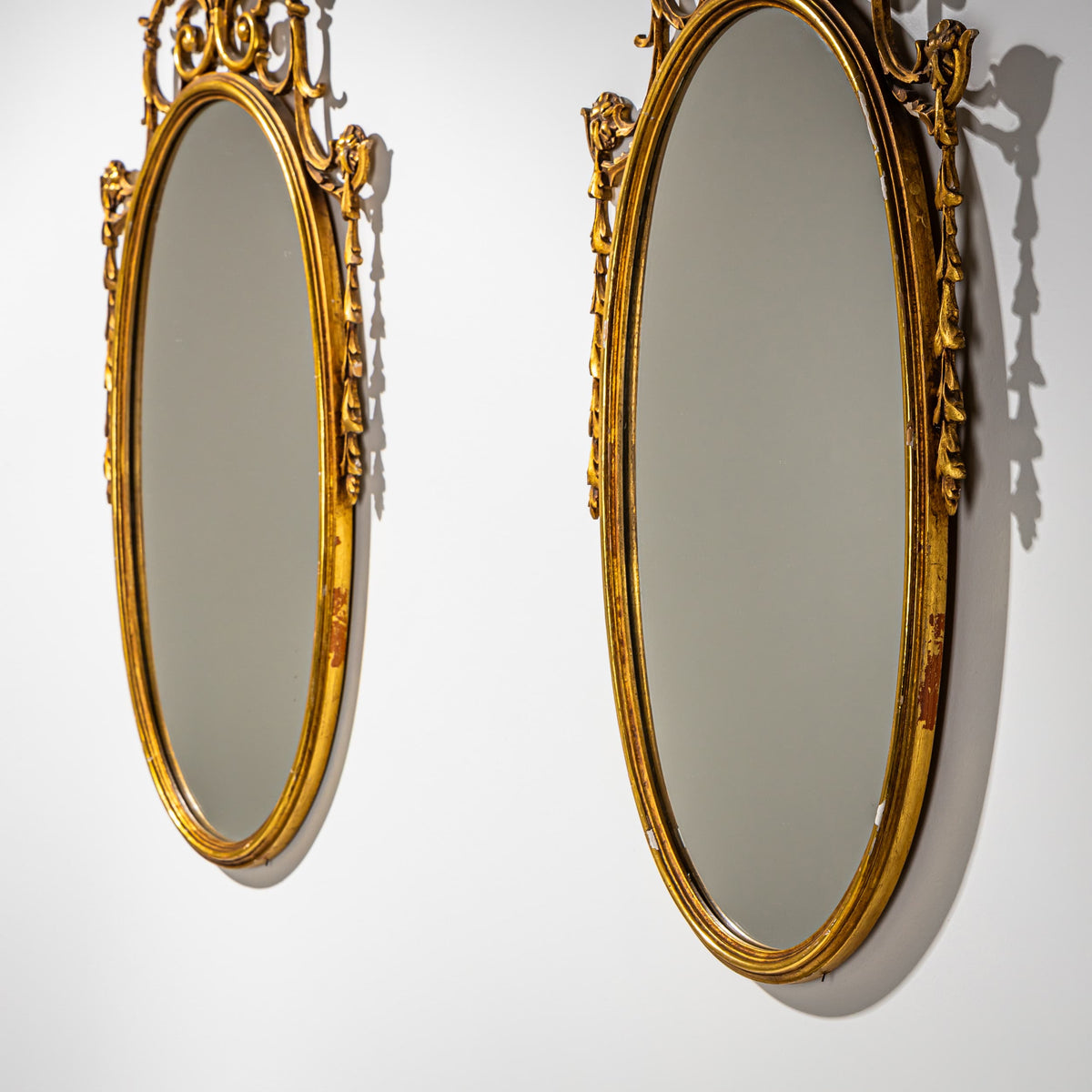 Pair of oval Giltwood Wall Mirrors, Italy Mid-20th Century