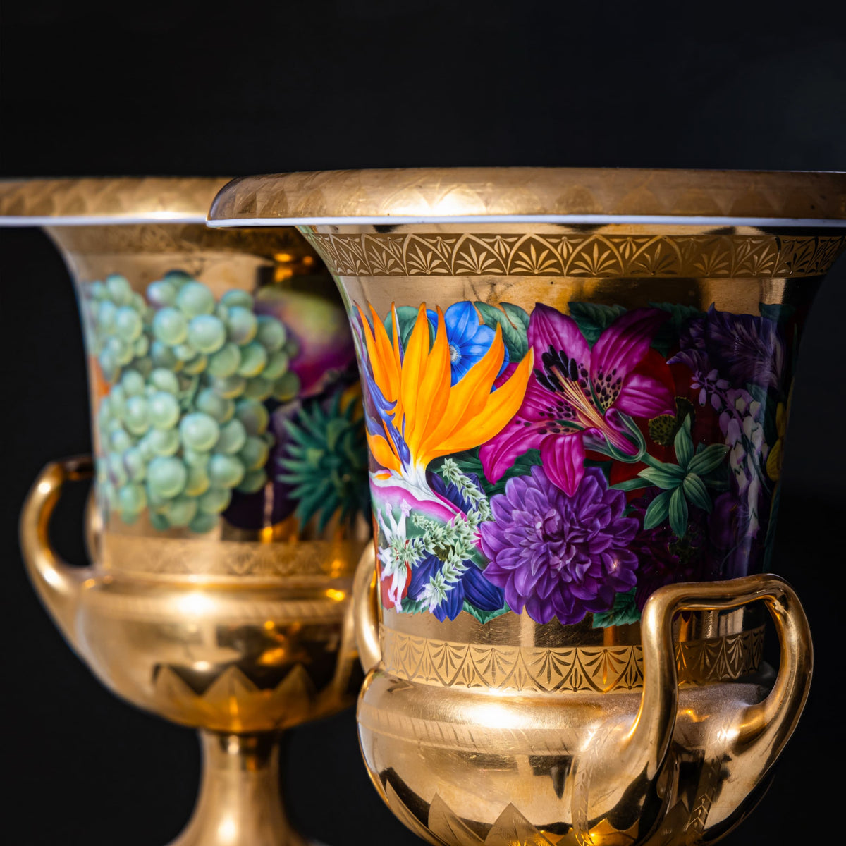 Decorative urn with floral design and gold accents on a black background