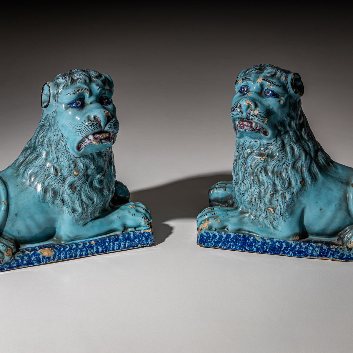 Pair of Recumbent Blue Faience Lions, probably France, 18th Century