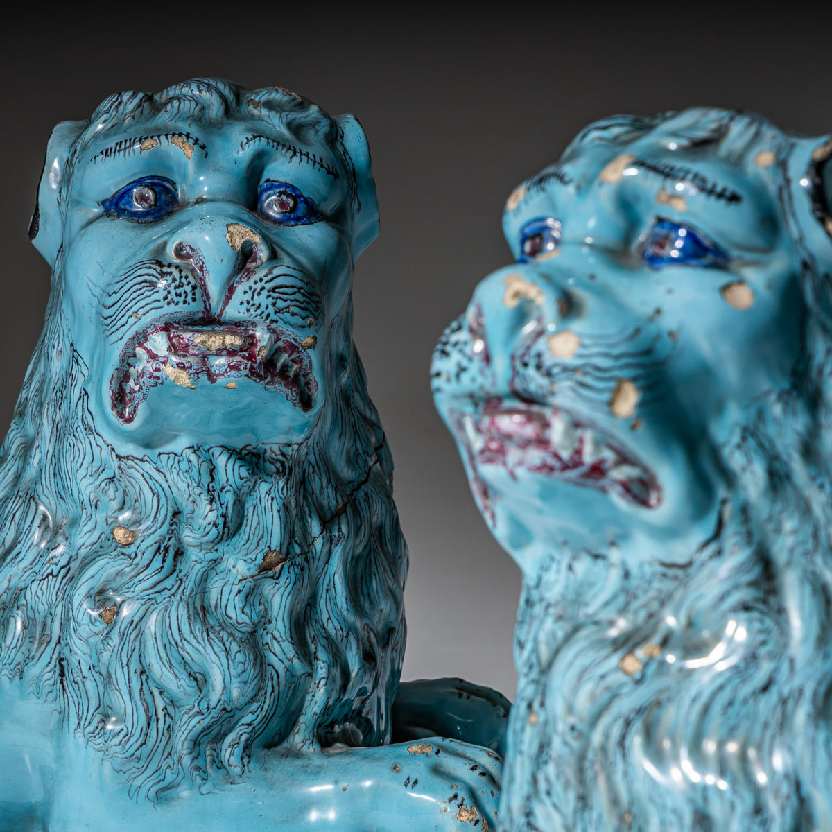 Pair of Recumbent Blue Faience Lions, probably France, 18th Century