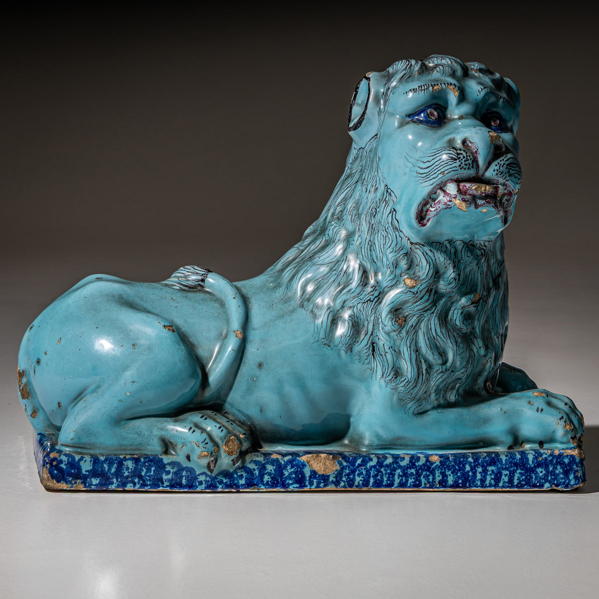 Pair of Recumbent Blue Faience Lions, probably France, 18th Century