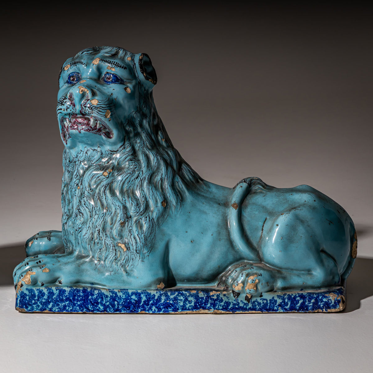 Pair of Recumbent Blue Faience Lions, probably France, 18th Century