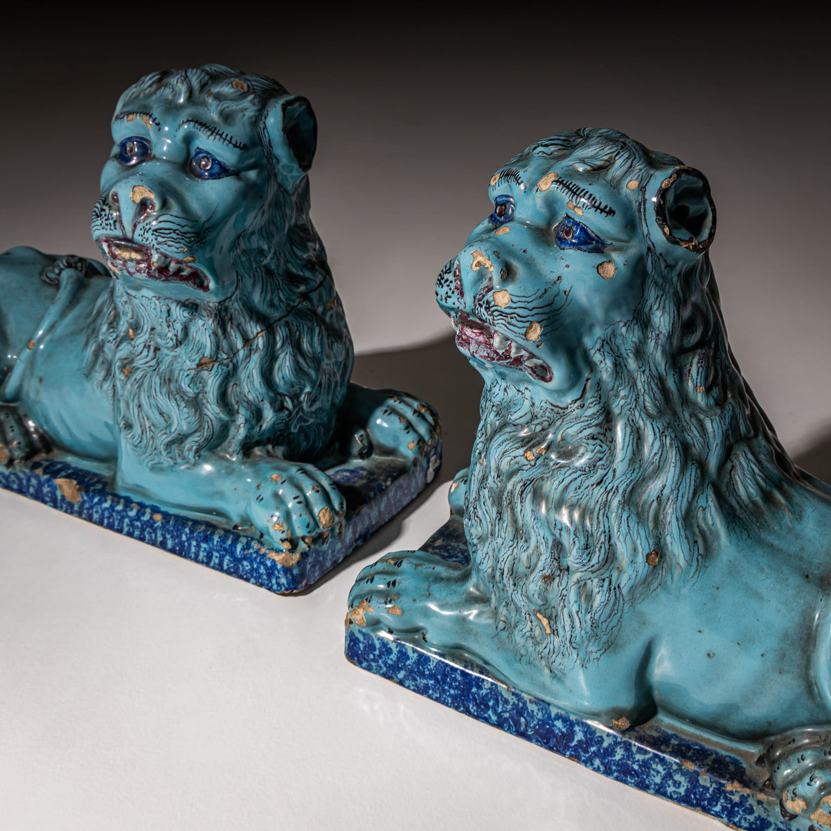 Pair of Recumbent Blue Faience Lions, probably France, 18th Century