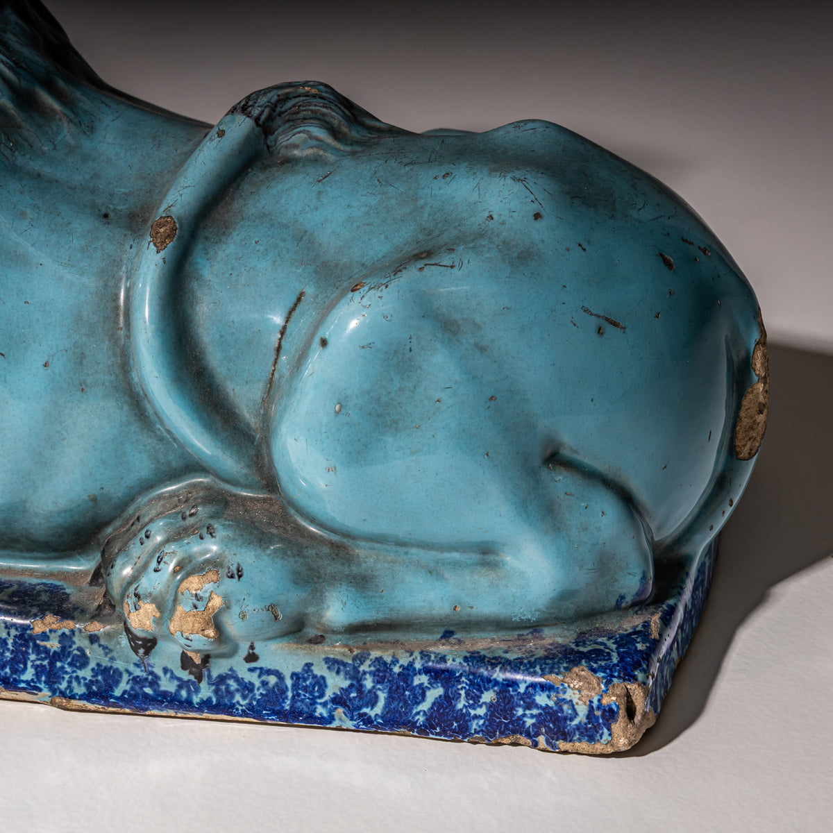 Pair of Recumbent Blue Faience Lions, probably France, 18th Century