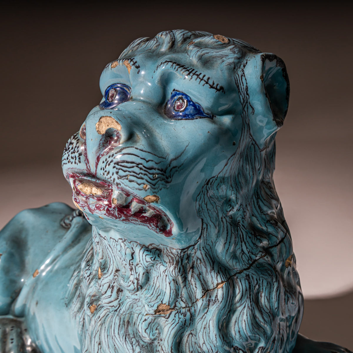 Pair of Recumbent Blue Faience Lions, probably France, 18th Century