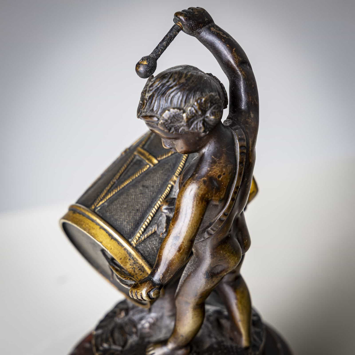 Small Bronze Sculpture of a drumming child, Late 19th Century