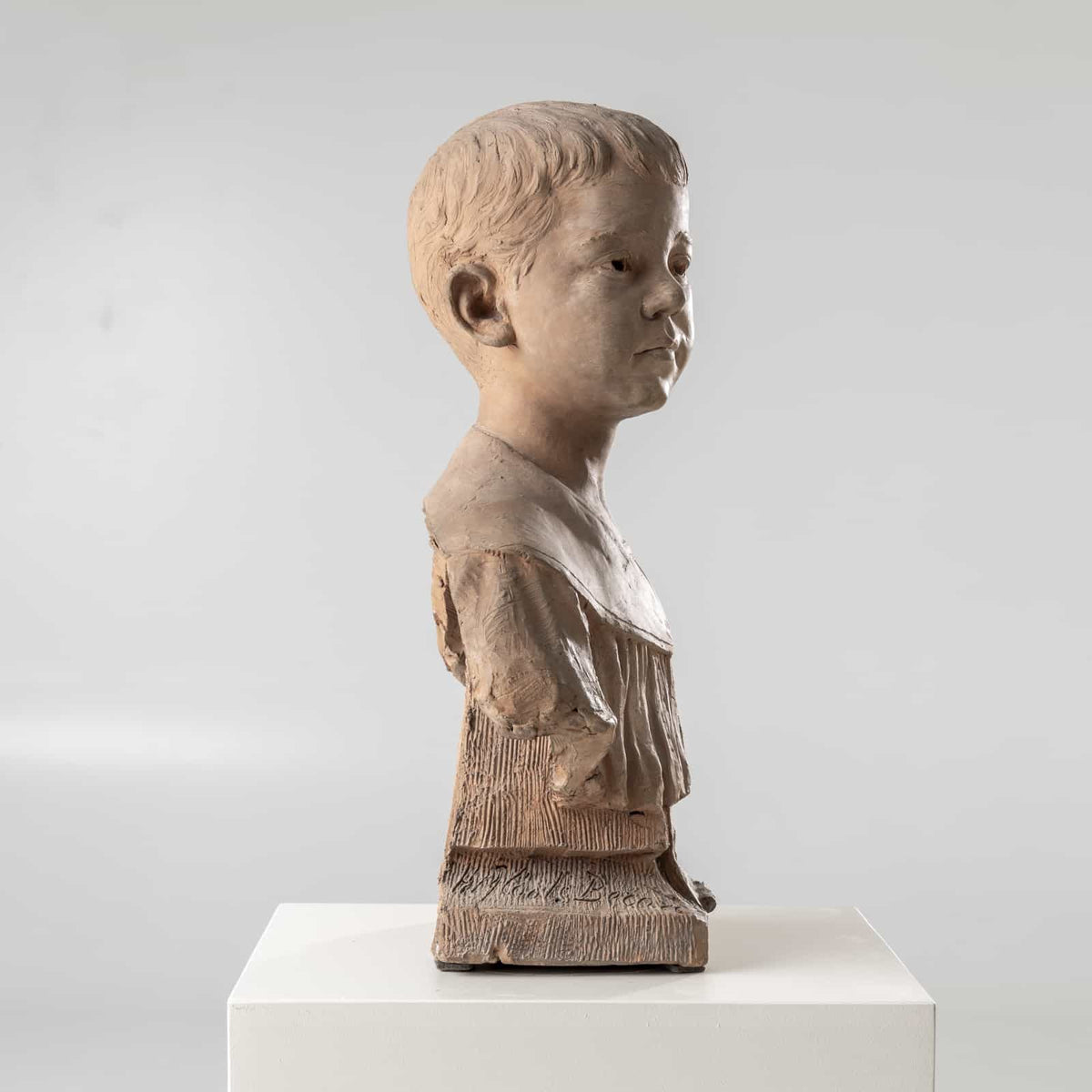 Bust of a boy in terracotta, signed H.M. Becoré, France, 2nd half of the 19th century
